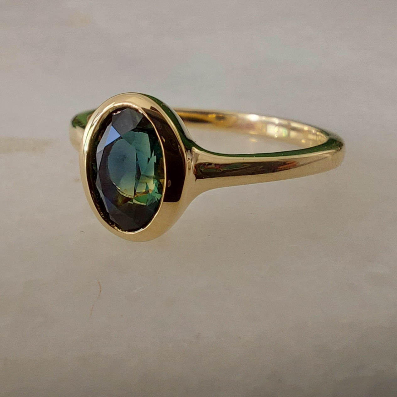 .90ct Teal Oval Australian Sapphire 9ct Yellow Gold ring